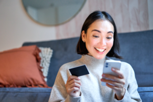 A Samsung Galaxy Foldable 8 smartphone next to a BRI Credit Card, representing exclusive pre-order deals.